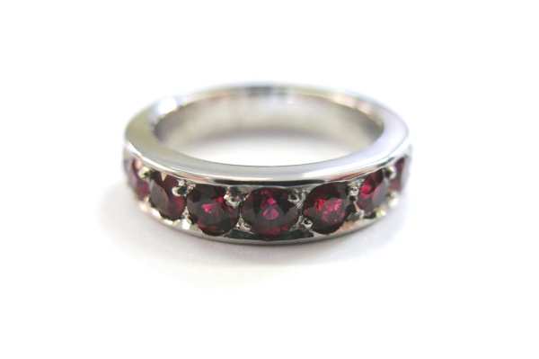 Platinum wedding ring with bead set rubies