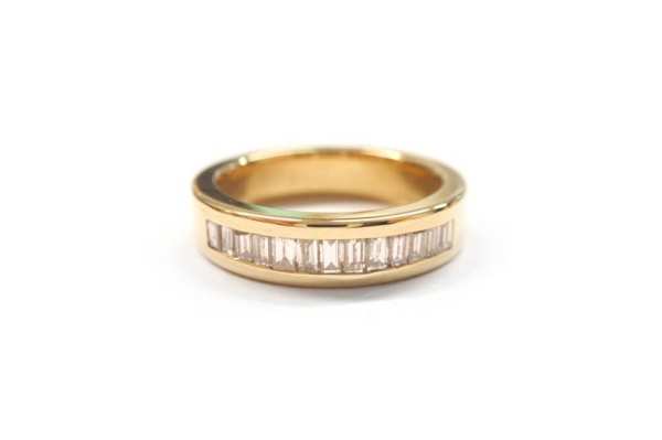 Baguette diamonds channel set in yellow gold band