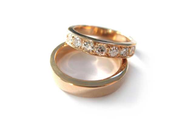 Rose gold wedding set with pave set brilliant cut diamonds and plain band