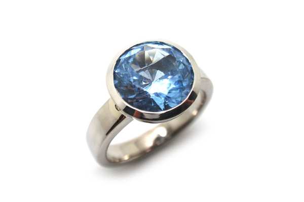 Large blue spinel bezel set dress ring