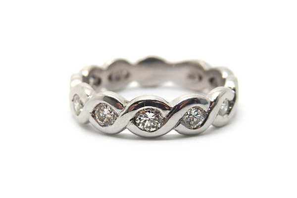 Woven metal and diamond dress ring