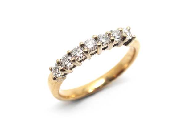 Share claw brilliant cut diamond white gold setting with a yellow gold band