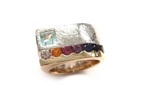 Multi coloured round cut sapphires with light blue topaz square