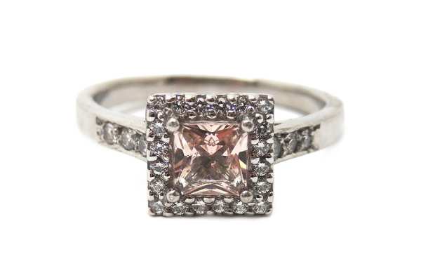 Pink sapphire squad cut with a surrounding halo and band of diamonds bead set