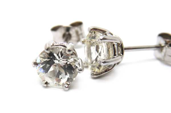 White sapphire round cut set in white gold stud earrings
