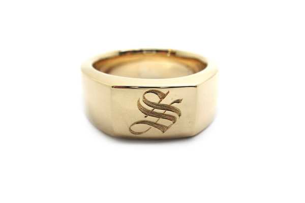 A collection of old gold that is melted down and remade into a new generation heirloom with a hand engrave initial