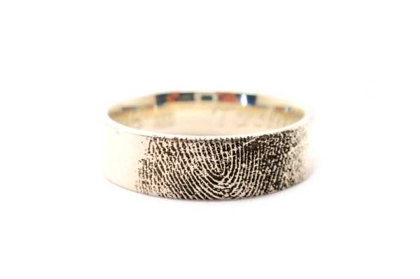 Laser engraved wedding ring, from an ink print, the image can be reproduced on any metal surface