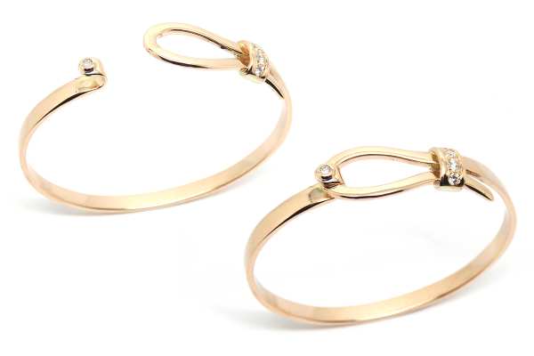 Opening love knot bangle with diamond detail