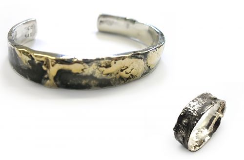Blackened sterling silver bangle and cuff with melted sections and organic forms. The cuff with yellow gold melted into the top