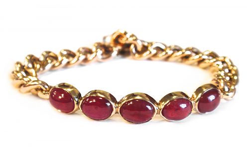 Bezel set cabochon rubies with a curb chain link