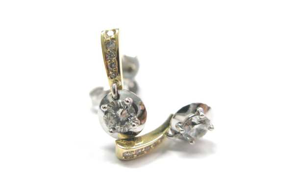 Brilliant cut diamonds claw and pave set into two tone moving earring 