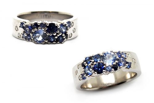 Multiple shades of Ceylon sapphires claw set in a white gold dress ring with hammer set diamonds