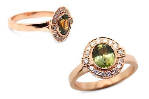 Green sapphire bezel set with a diamond art deco inspired halo set in rose gold