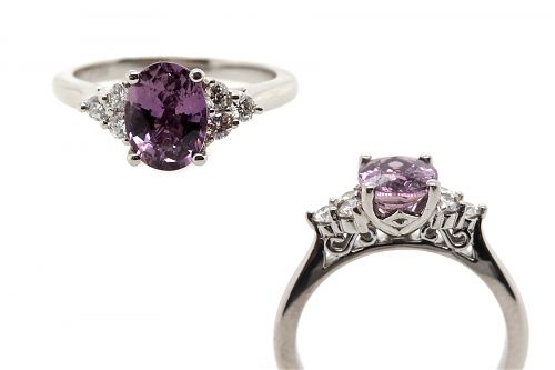 Oval purple sapphire with brilliant cut diamond side stones claw set in platinum with S side detail