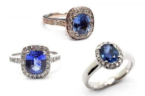 Three versions of the classic Ceylon sapphire claw set with a diamond halo set in white gold