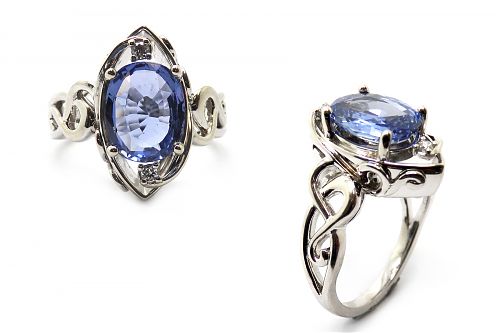 Oval blue sapphire claw set in a Cad designed dress ring and diamond details