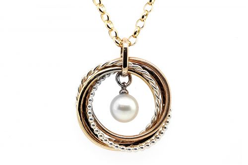 South Sea pearl surrounded by a five mixed metal and textured interlinking ring pendant