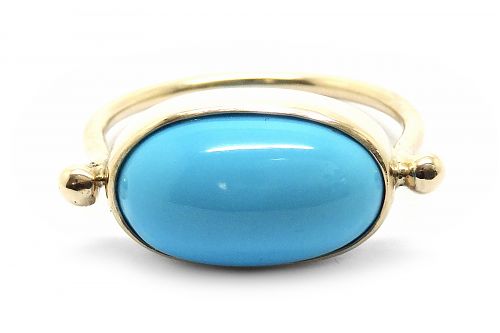 Sleeping beauty turquoise cabochon bezel set dress ring in yellow gold