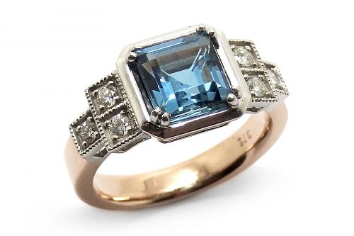 London blue topaz and diamond set in white gold with a rose gold band, set in an Art Deco inspired design