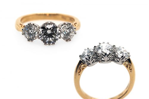 Edwardian inspired three brilliant cut lab grown diamonds claw set in platinum with a side detailed yellow gold band