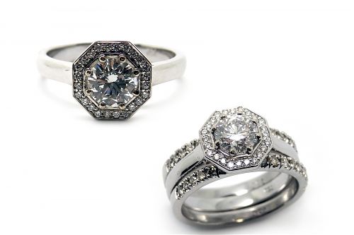 White gold hexagon setting with centre brilliant cut diamond surrounded but a halo of diamonds