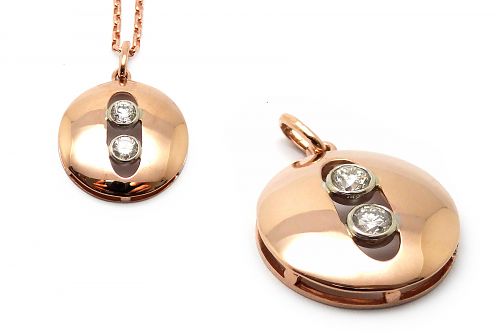 Rose gold domed pendant with white gold diamond set bezel cut out centre