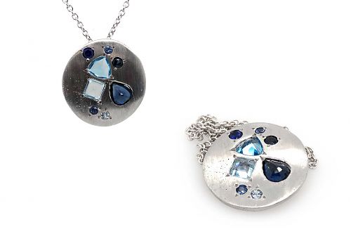Organically oval shaped white gold Ceylon sapphires and topaz stone pendant