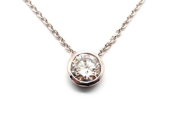 Brilliant cut round diamond bezel set floating pendant 