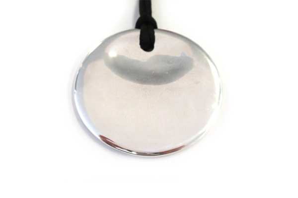 Solid silver hand carved disc pendant
